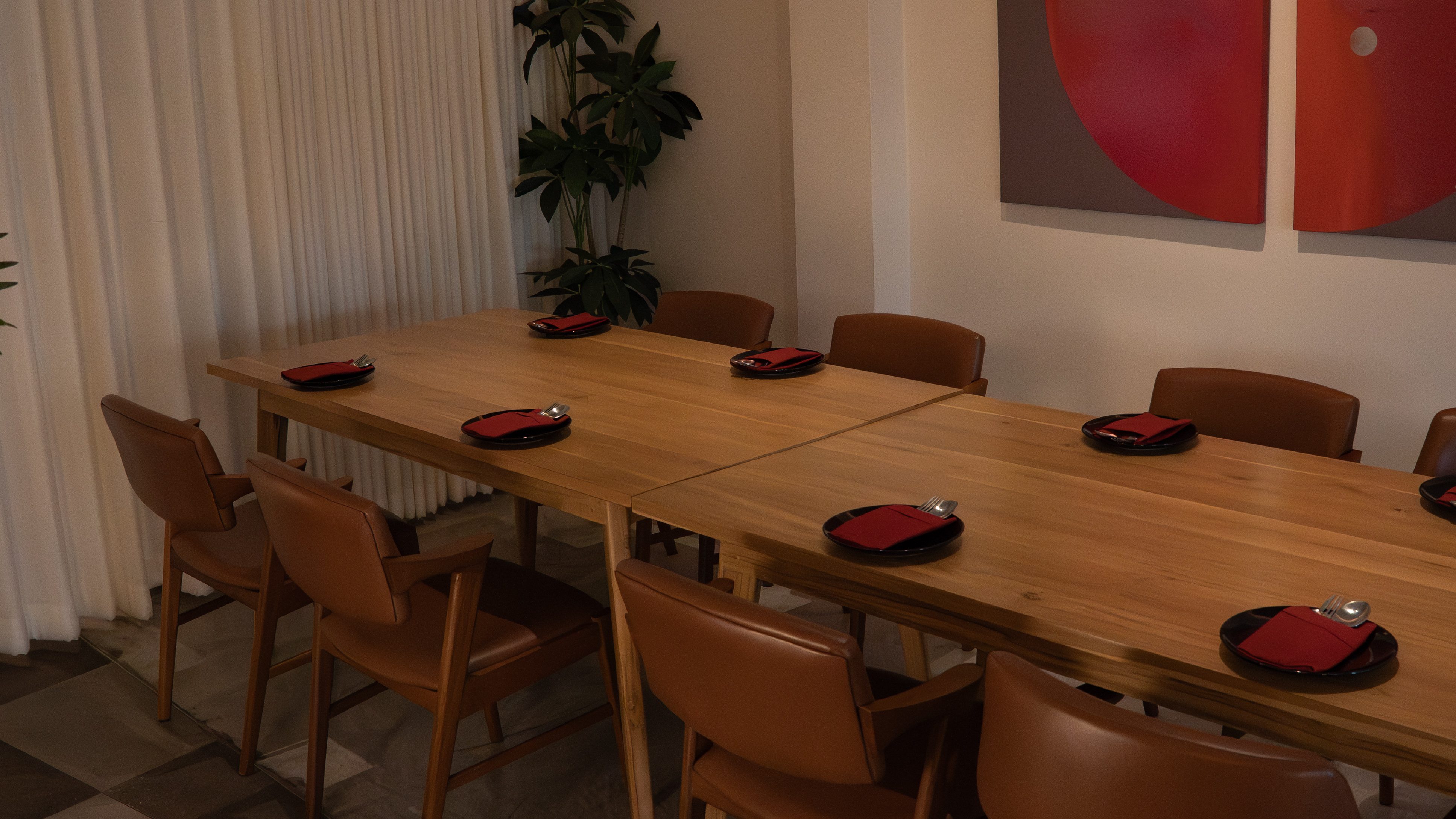 Tables and seating thoughtfully arranged for guests to enjoy dishes crafted by the chef.