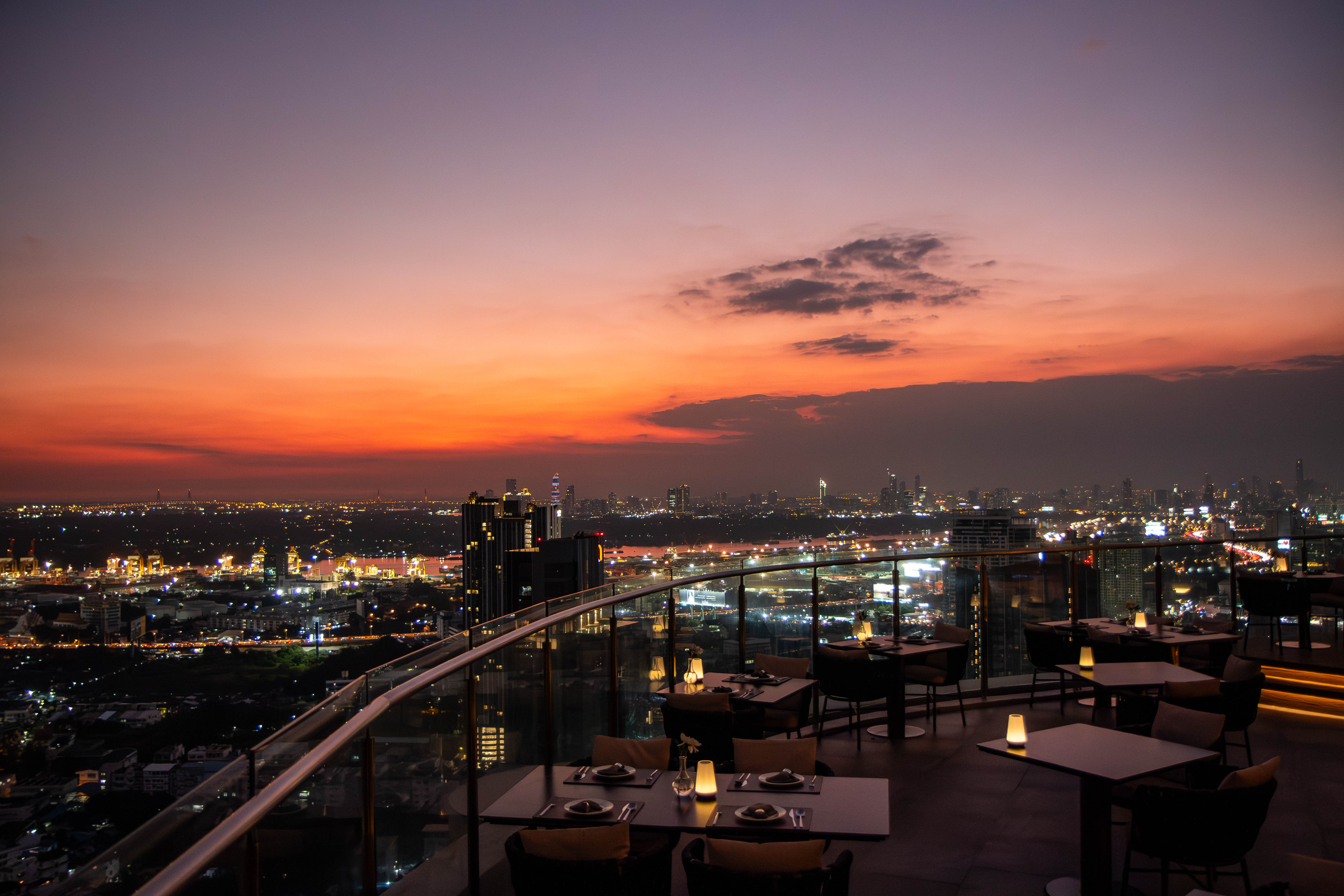 The breathtaking atmosphere of the sky from a high-rise building, offering stunning panoramic views and a memorable rooftop experience.