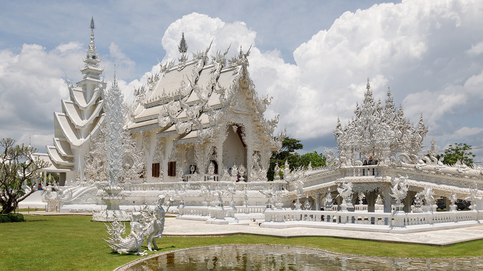Wat Rong Khun White Temple main ubosot with mirrored glass details, Chiang Rai, Thailand