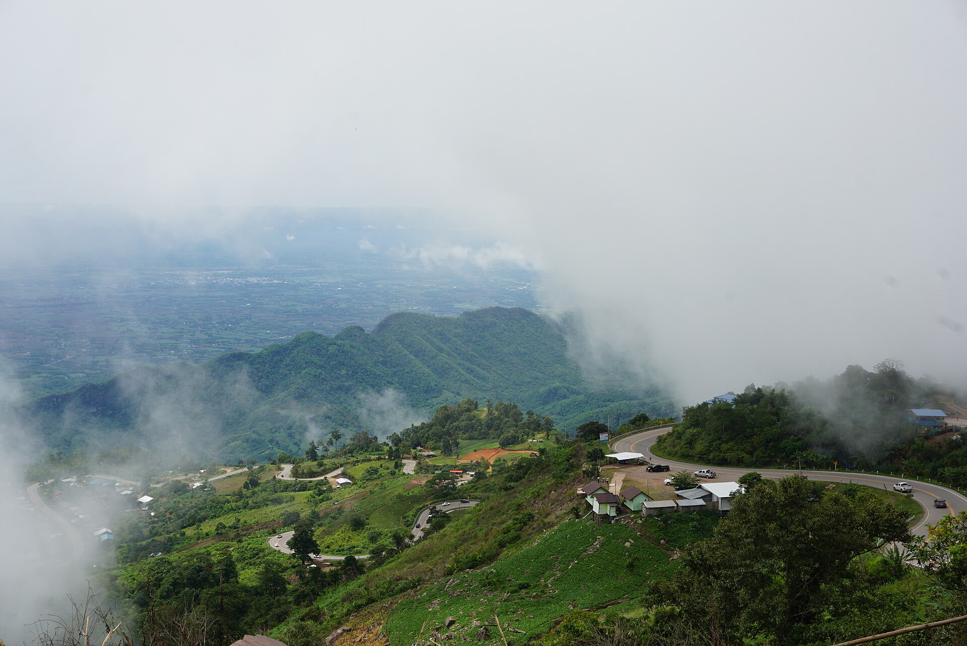 Morning mist drifting over the hills and resorts of Phu Thap Boek