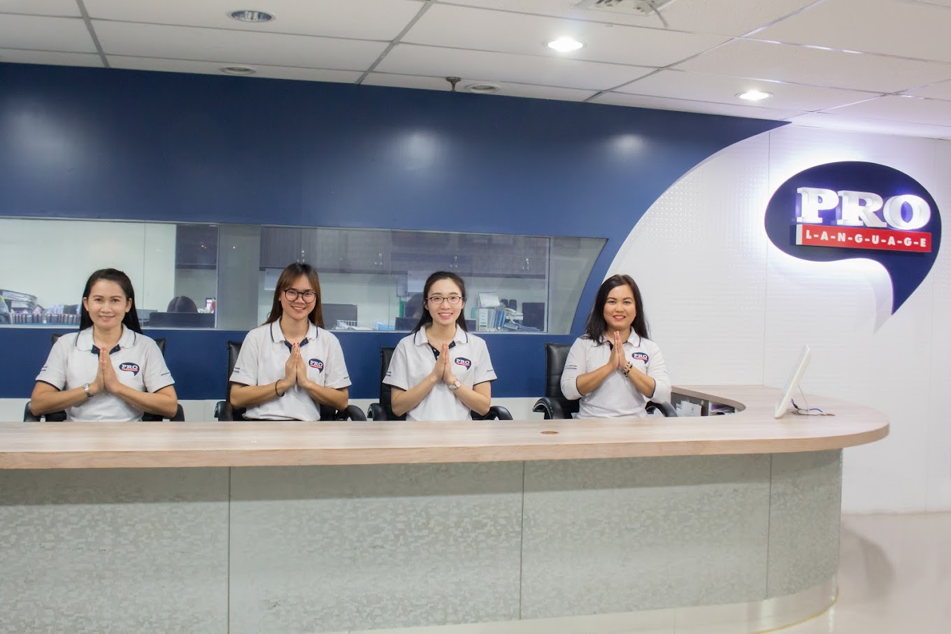 Friendly staff at Pro Language School Bangkok reception desk