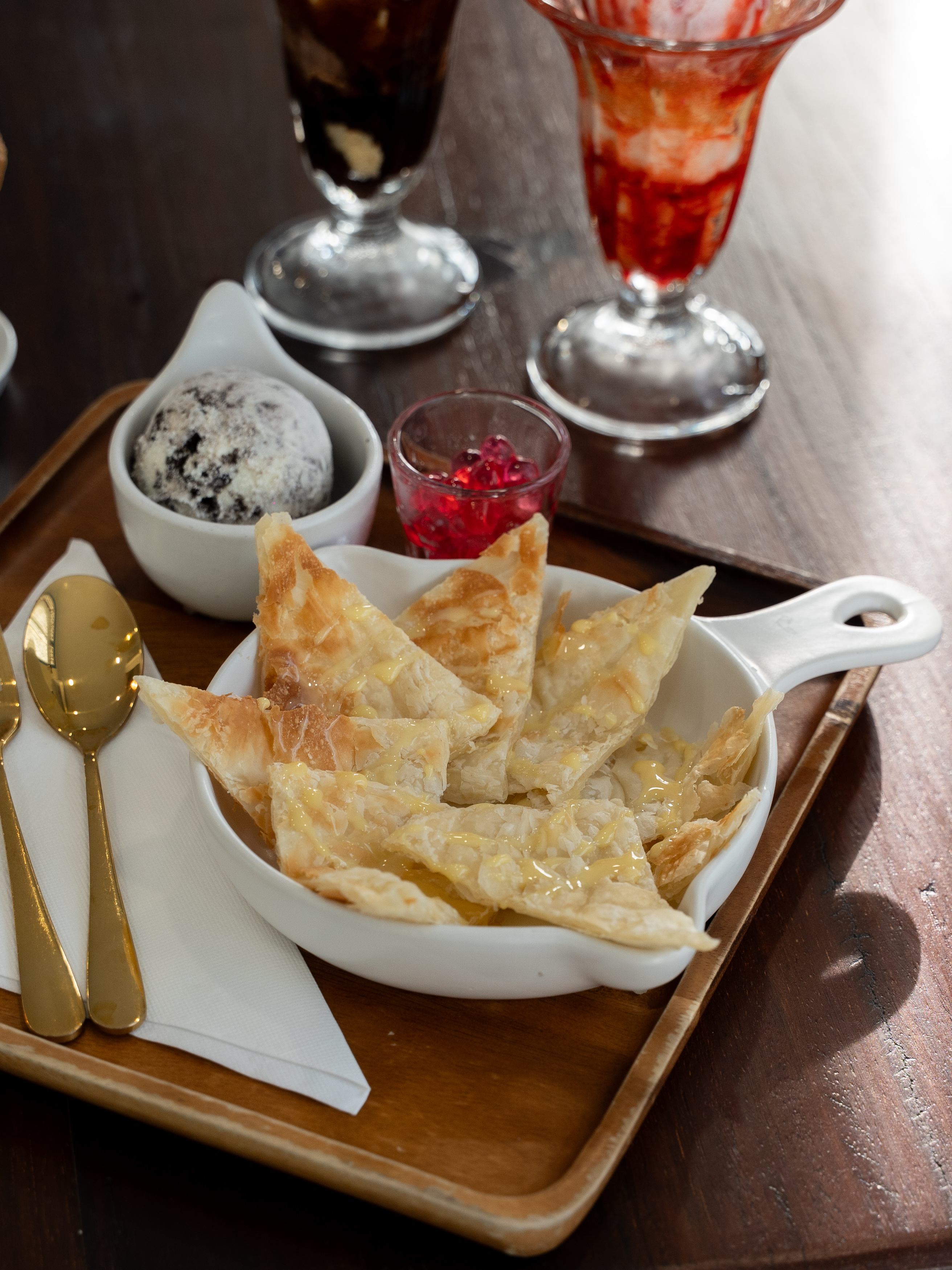 Enjoy a delicious ice cream dessert served with tasty toppings at Duckie Doze.