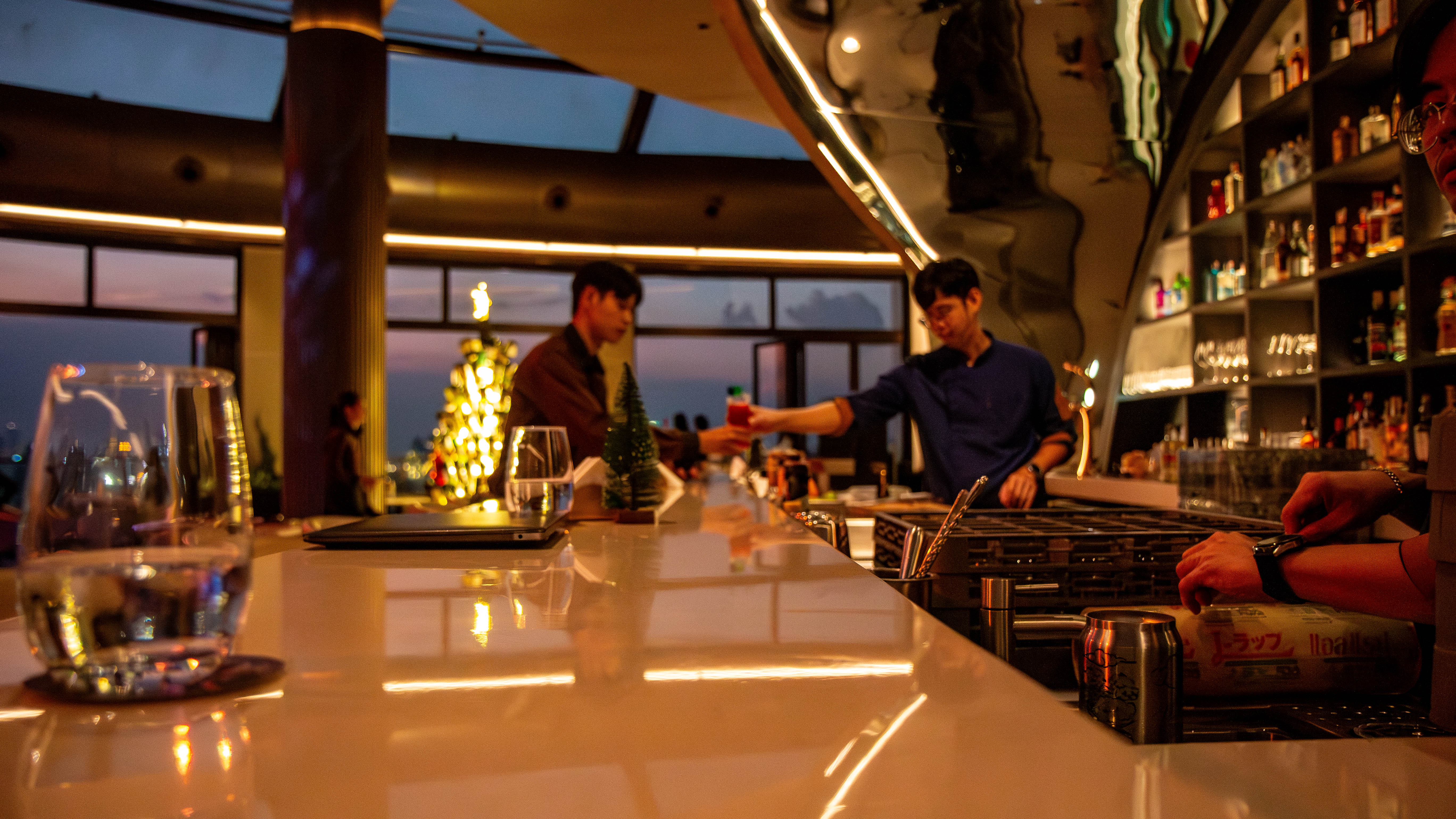 Inside the venue, there is a stylish bar area where guests can relax, unwind, and enjoy drinks in a comfortable atmosphere.