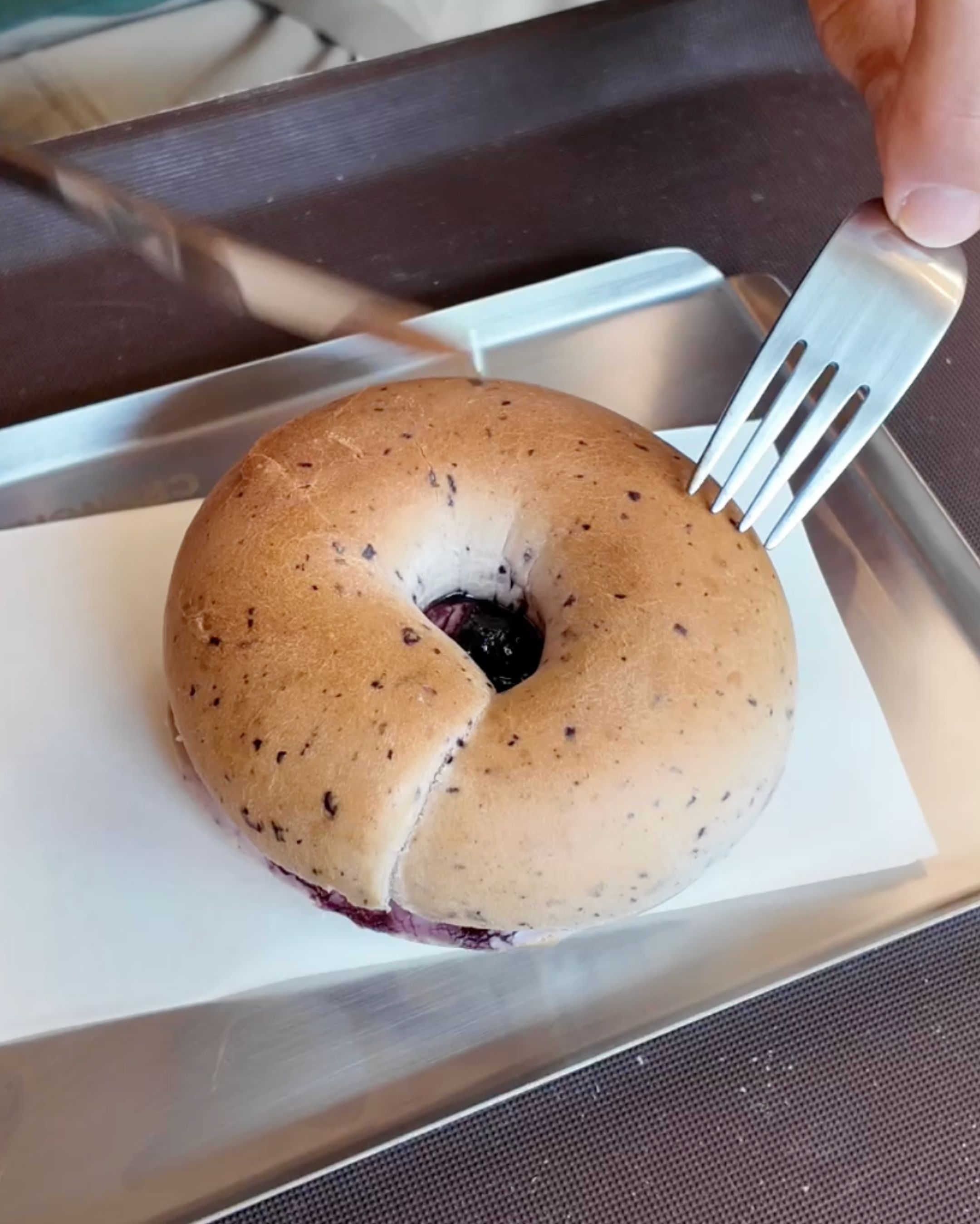 Enjoy a freshly prepared bagel, perfect for a quick breakfast in Sathorn, Bangkok.