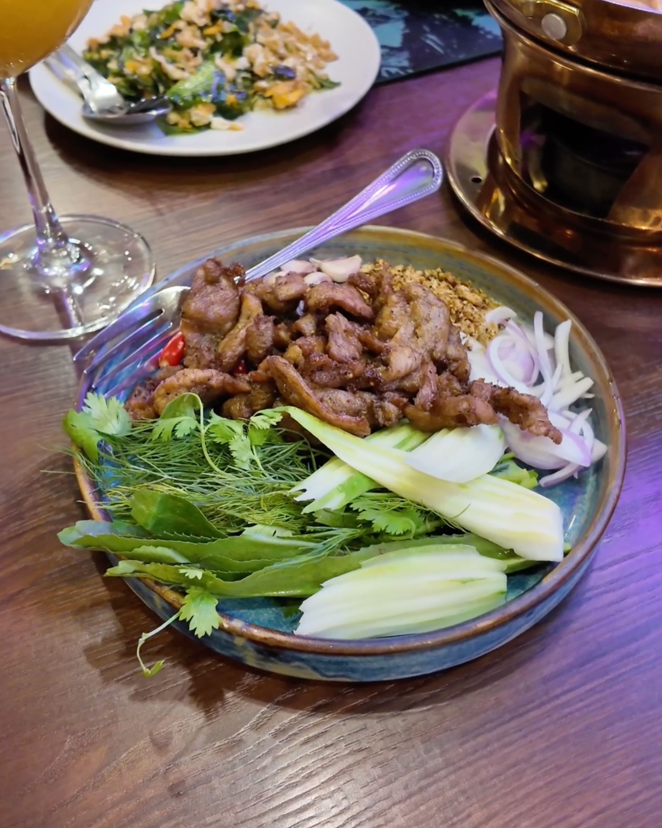 Enjoy tasty Thai meat served with fresh vegetables and aromatic herbs.