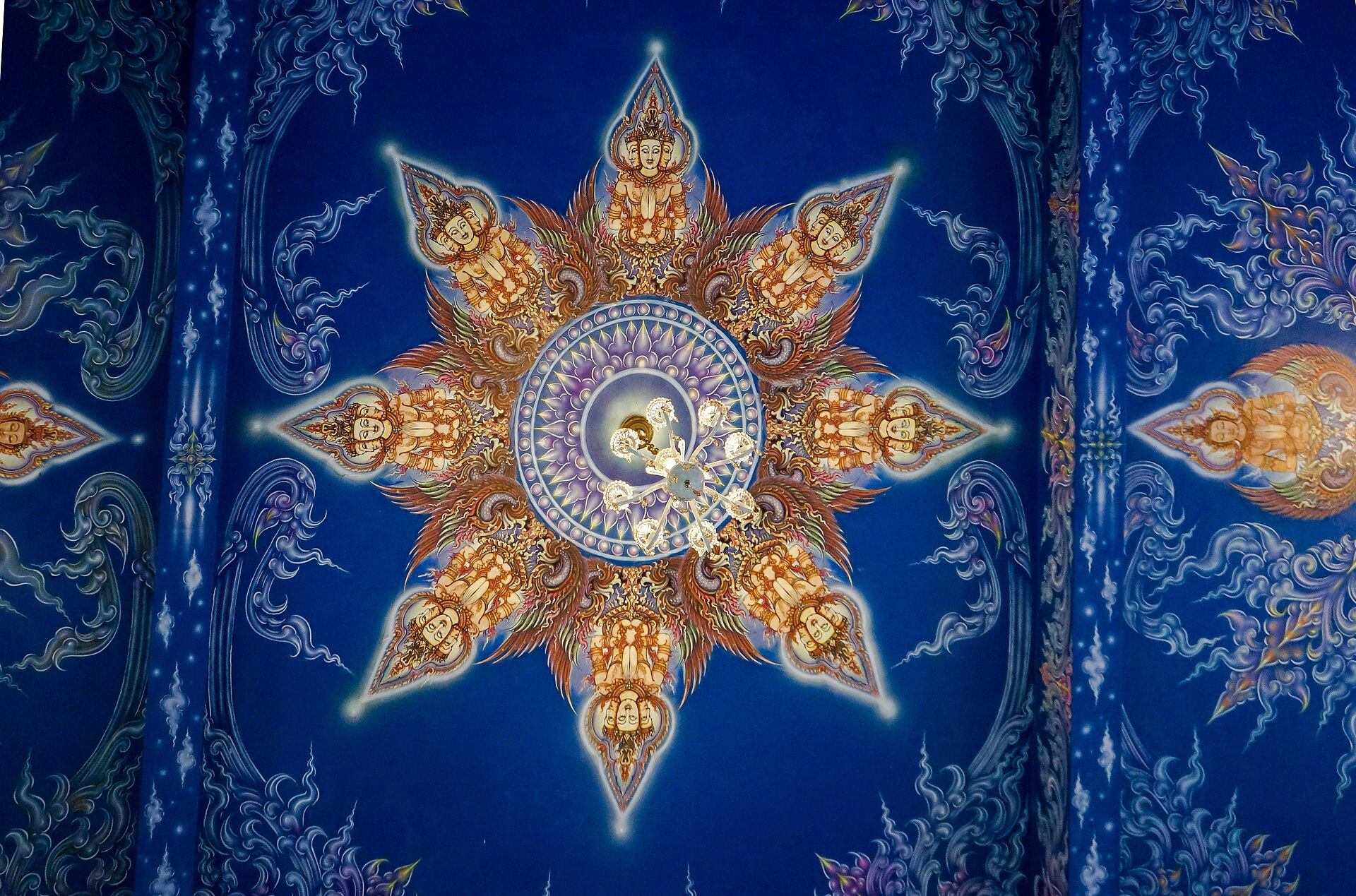 Blue and gold mandala ceiling at Wat Rong Suea Ten