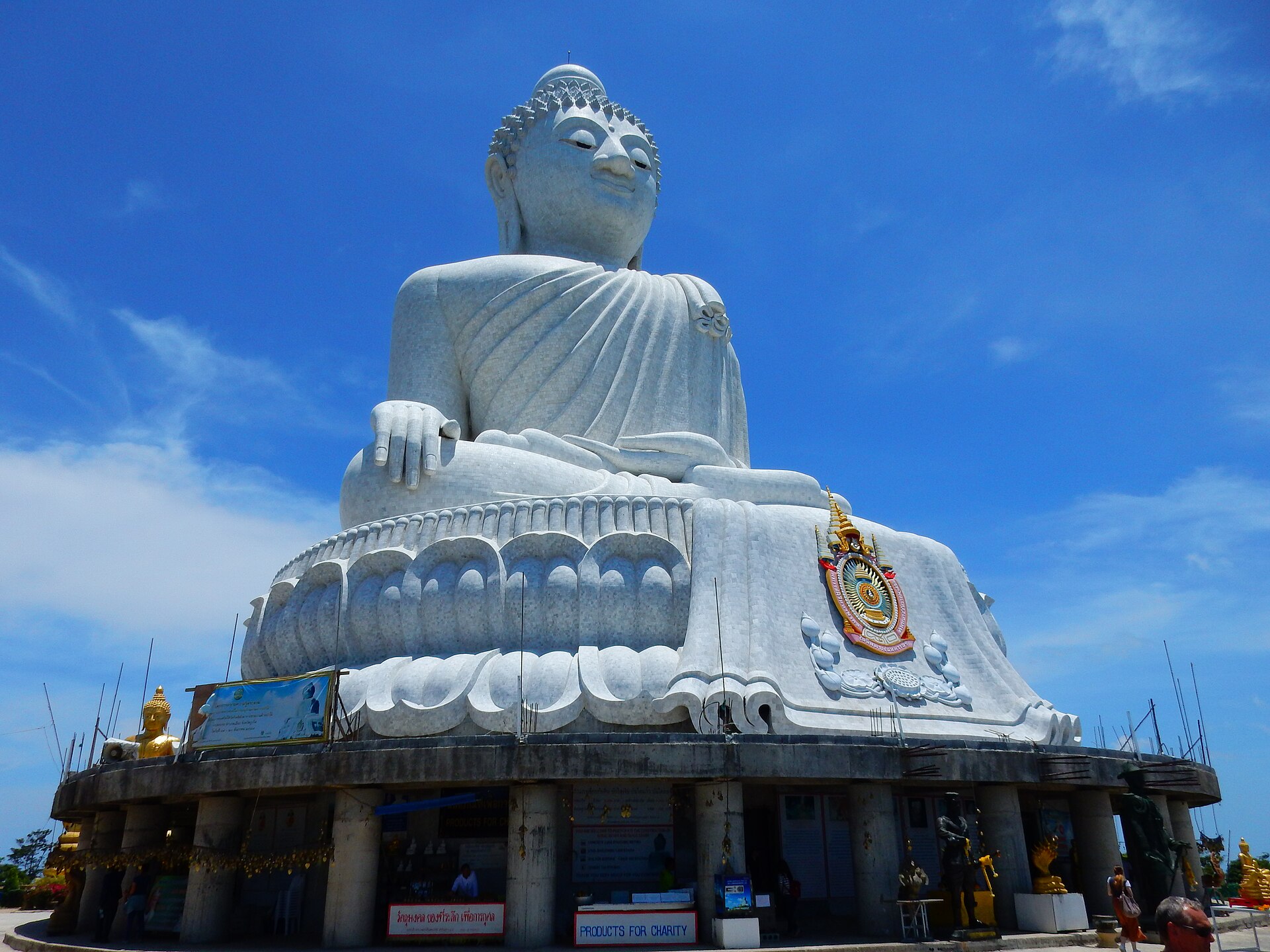 White marble Big Buddha statue in Phuket against a blue sky